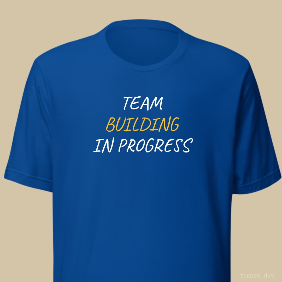 royal t-shirt with text "TEAM BUILDING IN PROGRESS" in hand font